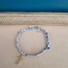 Bracelet coulissant Liberty croix et étoile acier inoxydable doré.
