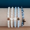 Bijoux religieux: le Bracelet élastique croix en pure nacre et ses perles.