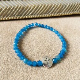 Bracelet élastique croix acier argenté.