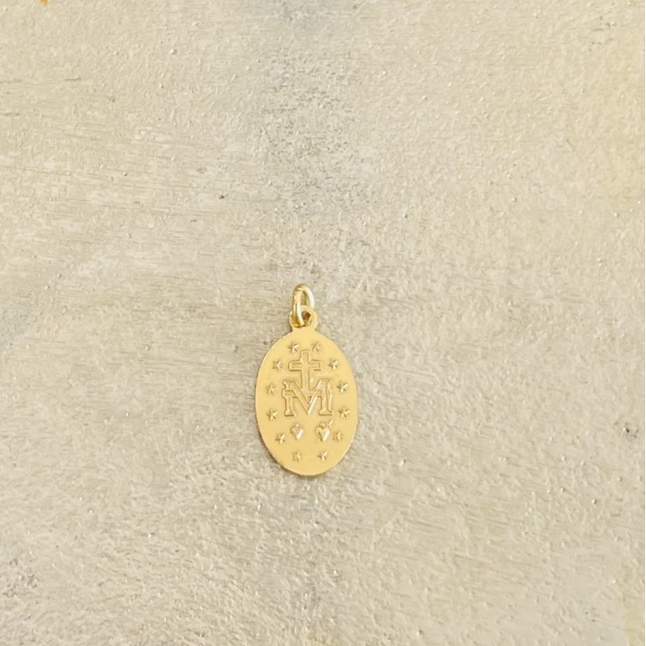 Médaille miraculeuse pailletée or , fond bleu marine.