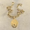 Un bijoux religieux : le bracelet médaille ex voto  acier doré inoxydable.