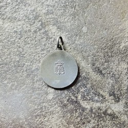 Petite médaille ronde en plaqué or signée Tairac.
